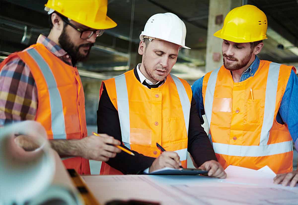 Industrial operations leader analyzing engineering workflows and modern workforce retention trends in a clean office setting.